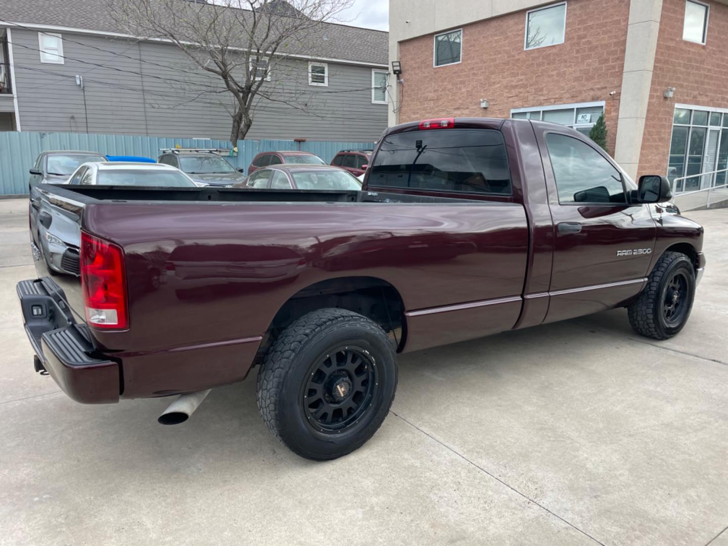 2004 Maroon /Black Dodge Ram 2500 Laramie 2WD (3D7KA26C44G) with an 5.9L L6 OHV 24V TURBO DIESEL engine, Automatic transmission, located at 1501 West 15th St., Houston, 77008, (713) 869-2925, 29.797941, -95.411789 - Photo#2